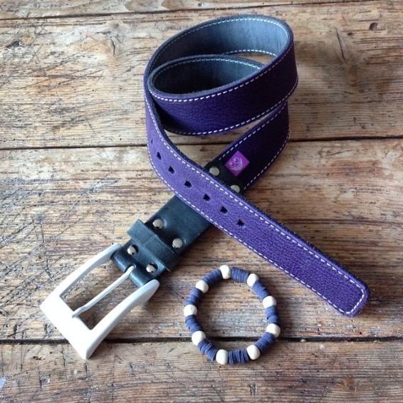 Purple leather belt with white buckle